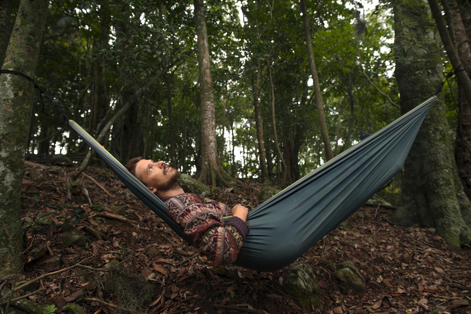 Full shot adventurous man bivouacking 2