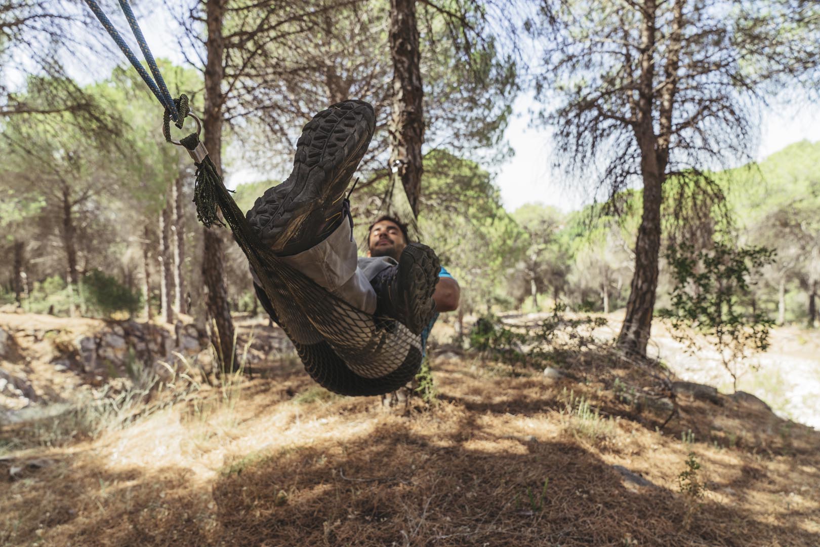 Man chilling hammock forest